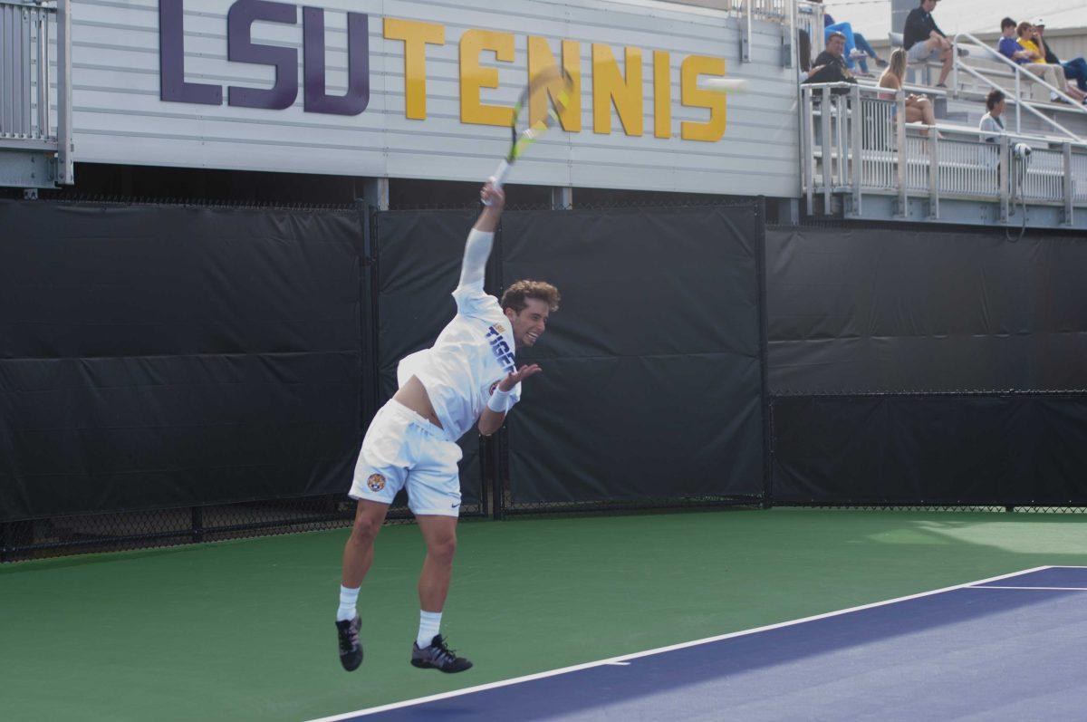 LSU junior men's tennis player Joey Thomas serves the ball on Wednesday, Mar. 11, 2020 during LSU's loss against the University of Memphis at the LSU Tennis Complex.&#160;