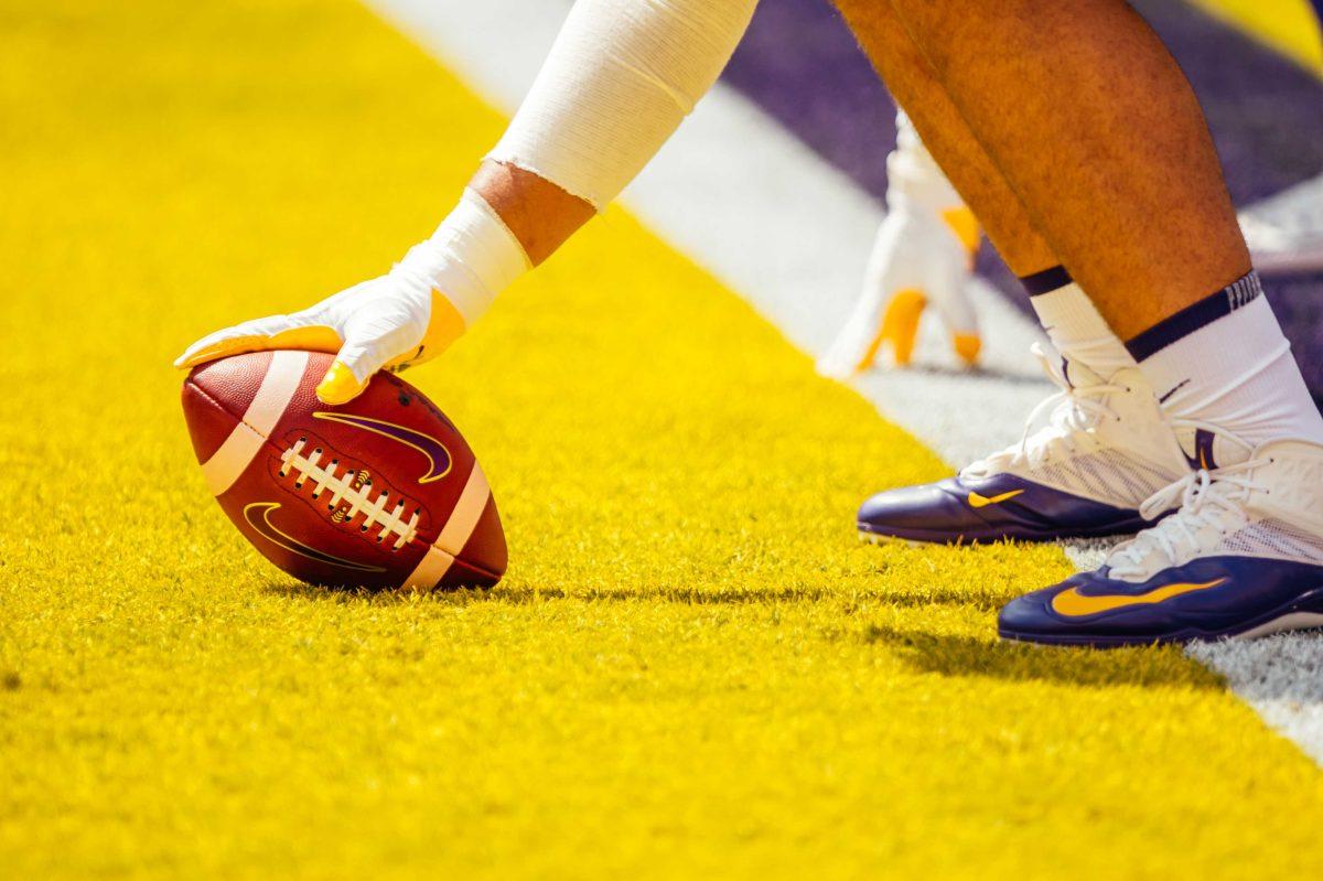 An LSU football player practices Saturday, Sep. 26, 2020 on the field before LSU's 44-24 loss against Mississippi State in Tiger Stadium.