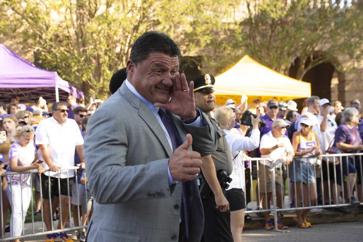 Coach O talks to a fan while coming down Victory Hill on Saturday, October 5, 2019.