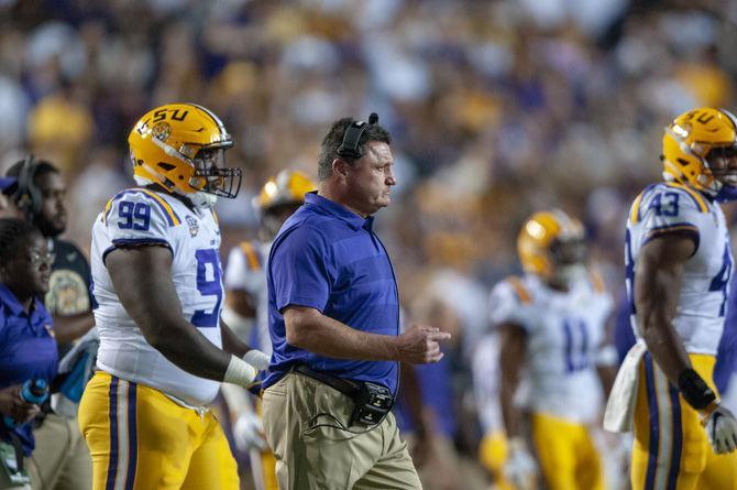 LSU head coach Ed Orgeron walks to meet with players during the Tigers&#8217; 29-0 loss against Alabama on Saturday, Nov. 3, 2018, in Tiger Stadium.