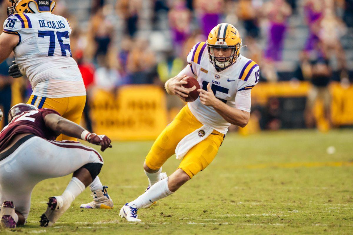 LSU football junior quarterback Myles Brennan (15) runs the ball Saturday, Sep. 26, 2020 during LSU's 44-24 loss against Mississippi State in Tiger Stadium.