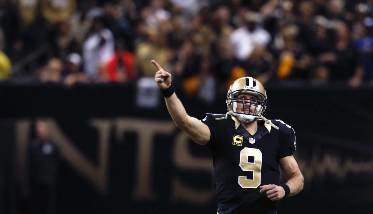 New Orleans Saints quarterback Drew Brees (9) reacts in the second half of an NFL football game against the New York Giants in New Orleans, Sunday, Nov. 1, 2015. Brees tied an NFL record for the most touchdown passes in a single game. The Saints won 52-49. (AP Photo/Jonathan Bachman)