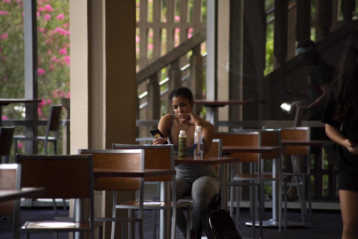 An LSU student looks at their phone on Wednesday, Sept. 9, 2020 in the Student Union on LSU's campus.