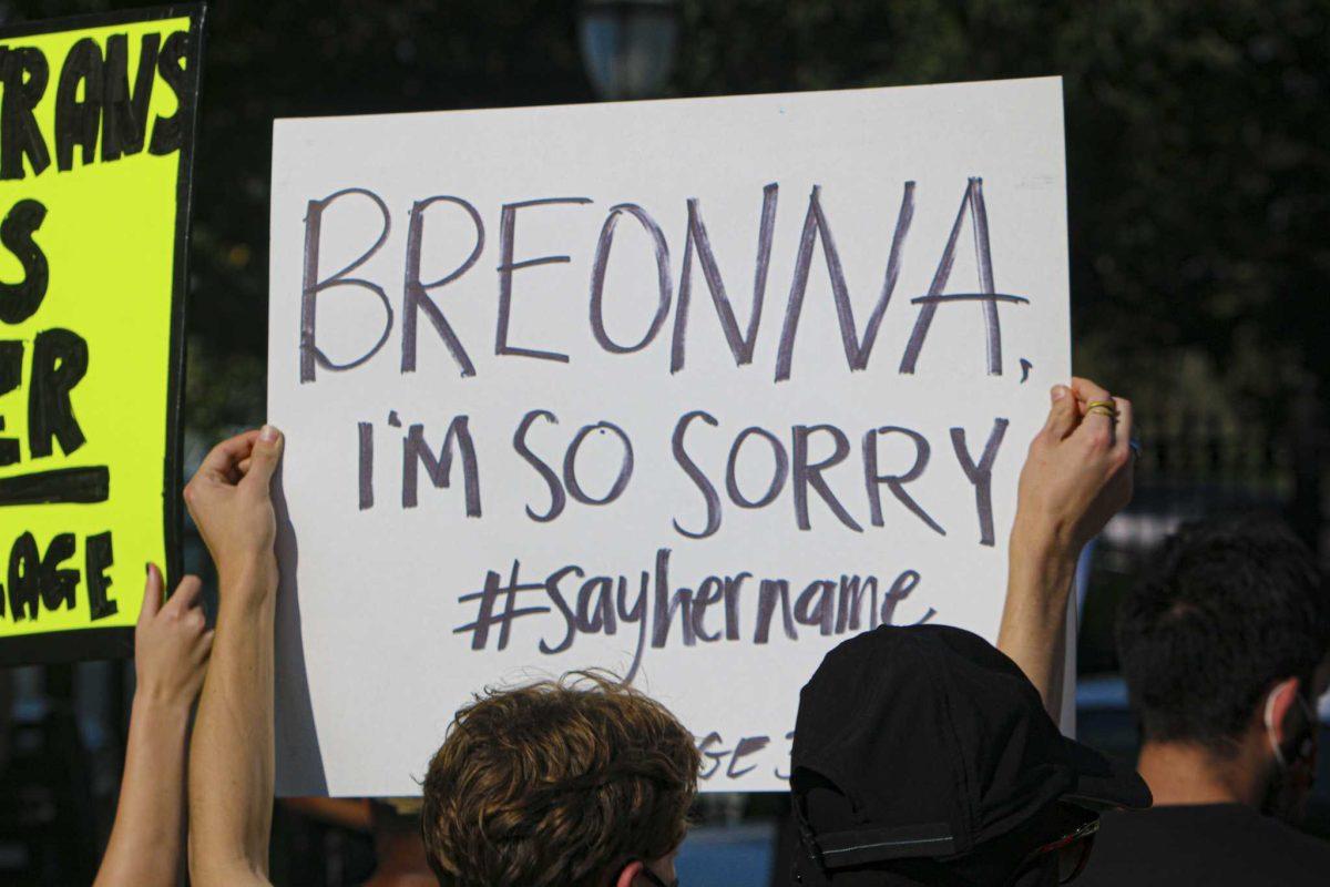 Protesters hold up their signs on Friday, Sept. 25, 2020 during protest in front of the Louisiana Governor's Mansion.