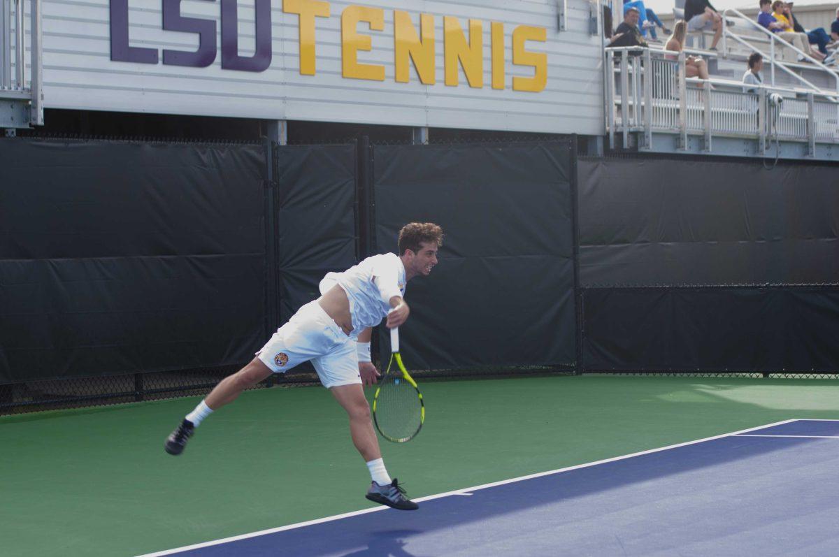 LSU junior men's tennis player Joey Thomas serves the ball on Wednesday, Mar. 11, 2020 during LSU's loss against the University of Memphis at the LSU Tennis Complex.&#160;