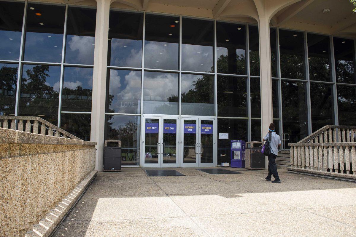 A worker enters the Student Union on Friday, Sept. 5, 2020 on LSU's campus.