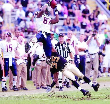 Chicago Bears wide receiver Muhsin Muhammad (87) makes one of his three catches on Sunday over New Orleans Saints cornerback Fakhir Brown in Tiger Stadium on Nov. 6, 2005. LSU hosted four Saints home losses after Hurricane Katrina devastated New Orleans. Reveille Archives