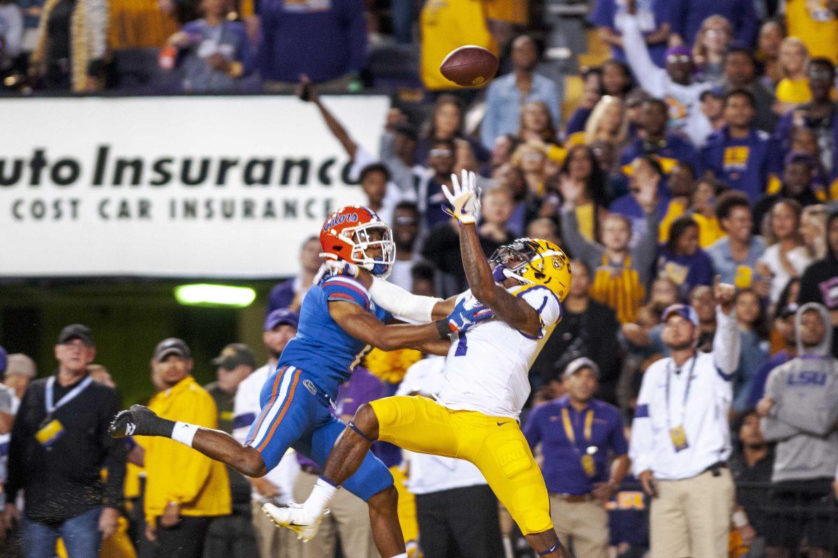 LSU sophomore wide receiver Ja'Marr Chase (1) leaps to catch the ball on Saturday, Oct. 12, 2019, during the Tigers' 42-28 victory against the Gators in Tiger Stadium.