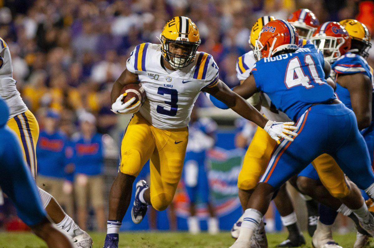 LSU freshman running back Tyrion Davis-Price (03) runs the ball during the Tigers' 42-28 victory over Florida on Saturday, Oct. 12, 2019, at Tiger Stadium.