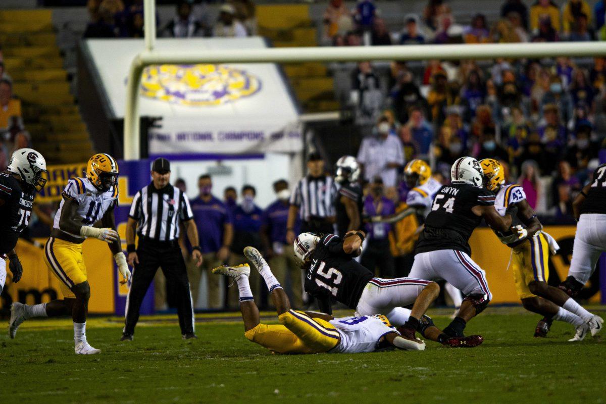 LSU football freshman outside linebacker BJ Ojulari (8) sacks SC quarterback Collin Hill (15) Saturday, Oct. 24, 2020 during LSU's 52-24 win against South Carolina in Tiger Stadium.