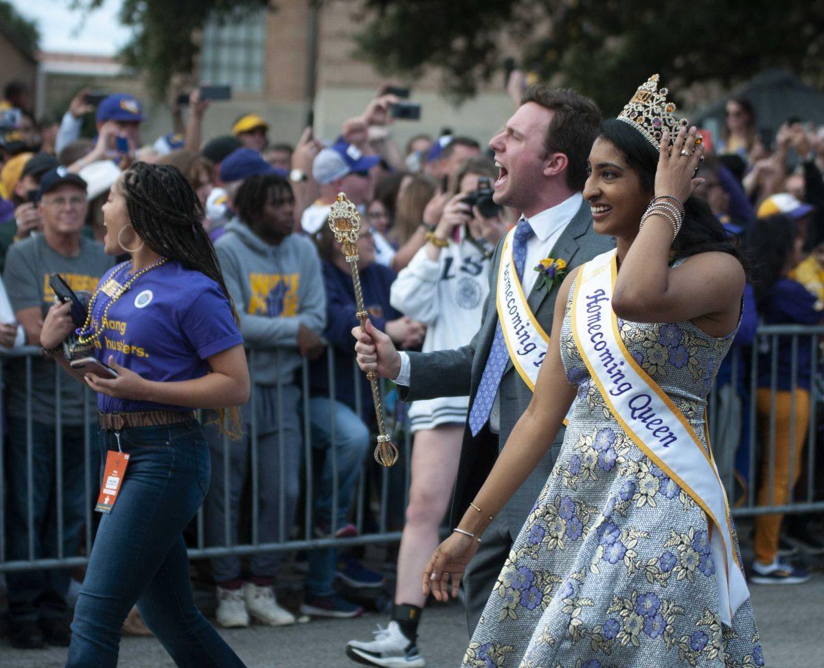 The LSU homecoming King and Queen walk down Victory Hill on Saturday, Oct. 12, 2019.