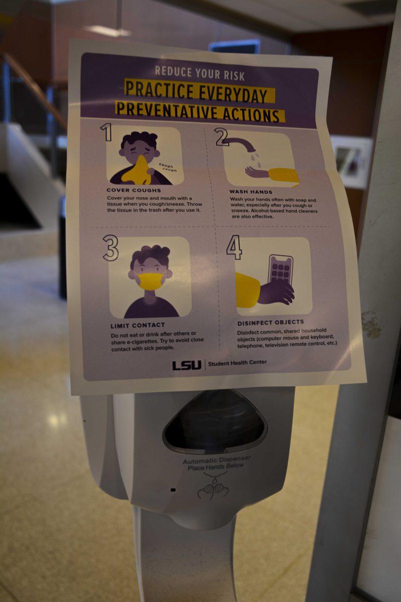 A hand sanitizer machine displays on Tuesday, October 6, 2020 the guidelines to reduce your risk to COVID-19 at LSU Student Union.