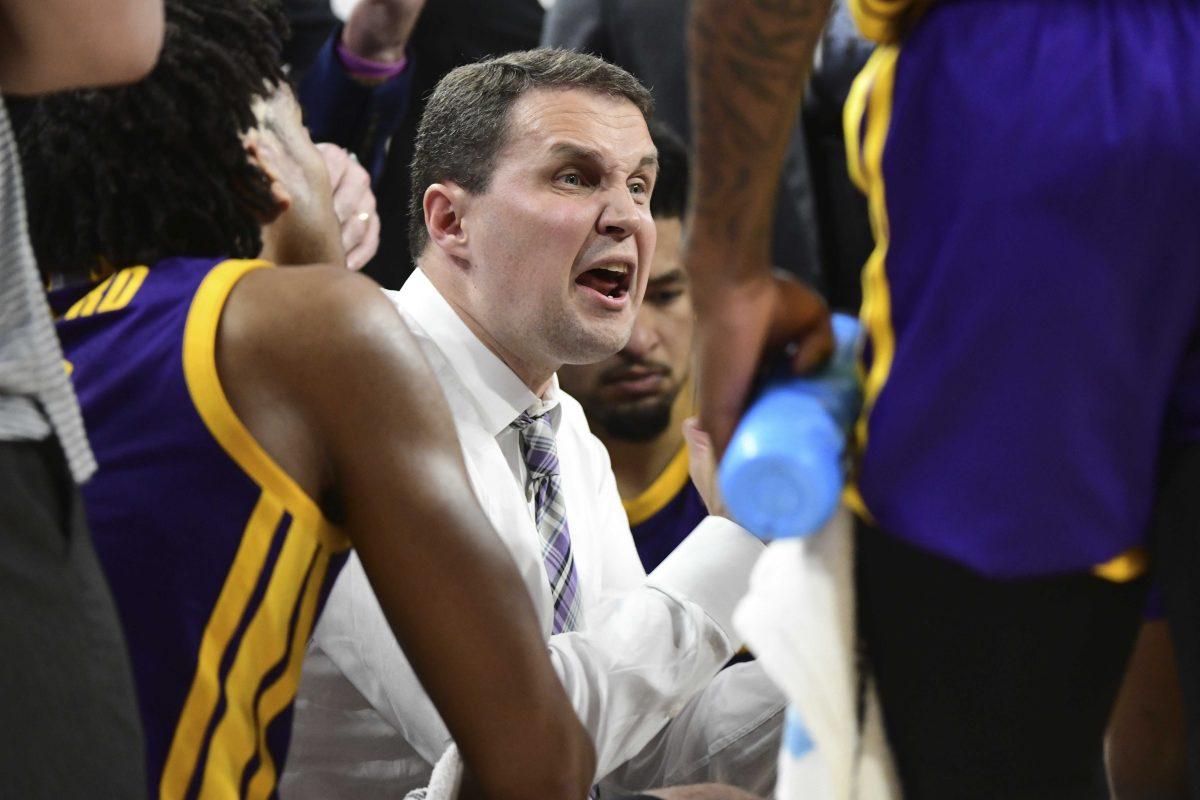 LSU coach Will Wade talks to his team as they play Arkansas during the first half of an NCAA college basketball game Wednesday, March 4, 2020, in Fayetteville, Ark. (AP Photo/Michael Woods)