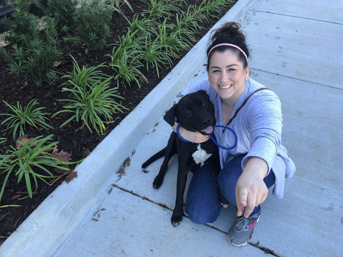 Lacey Lamana and her dog Kanye, who she rescued from Companion Animal Alliance.