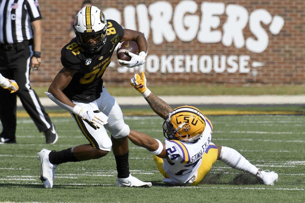 Missouri wide receiver Tauskie Dove (86) runs with the ball as LSU cornerback Derek Stingley Jr. defends during the first half of an NCAA college football game Saturday, Oct. 10, 2020, in Columbia, Mo. (AP Photo/L.G. Patterson)