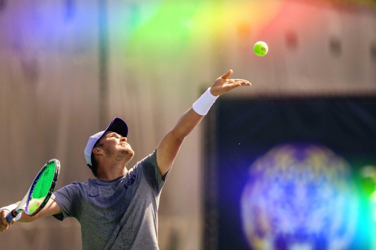 LSU men's tennis junior Boris Kozlov throws the ball up to serve Saturday, Oct. 3, 2020 during his and junior Nick Watson's 8-4 win against senior Malik Bhatnagar and freshman Ben Koch in the second match on the second day of the Olivier Borsos Invitational in the LSU Tennis Complex on Gourrier Avenue.