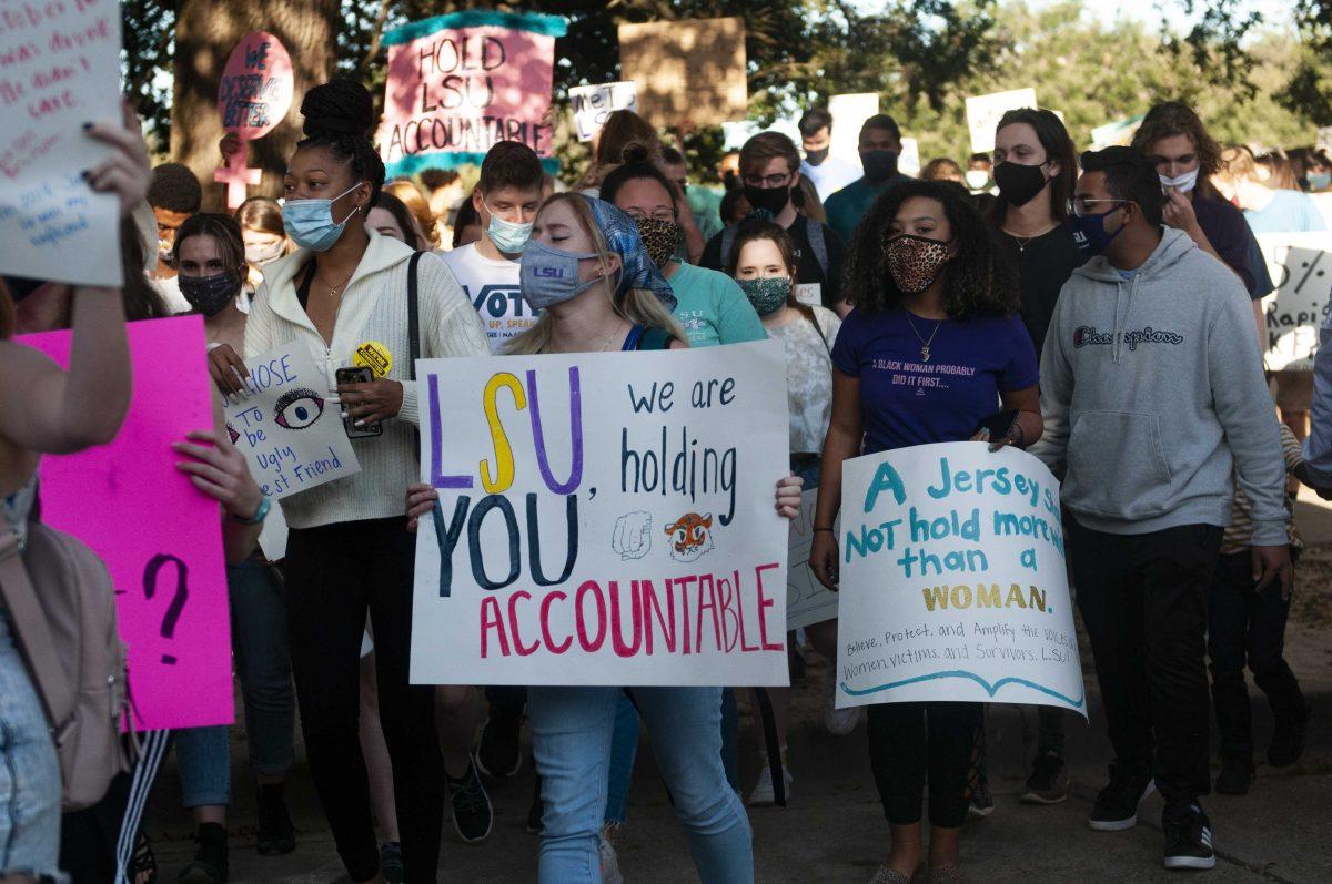 Protestors march together Friday, Nov. 20, 2020 during the protest following the USA Today article about mishandled sexual misconduct cases at the LSU Parade Grounds.