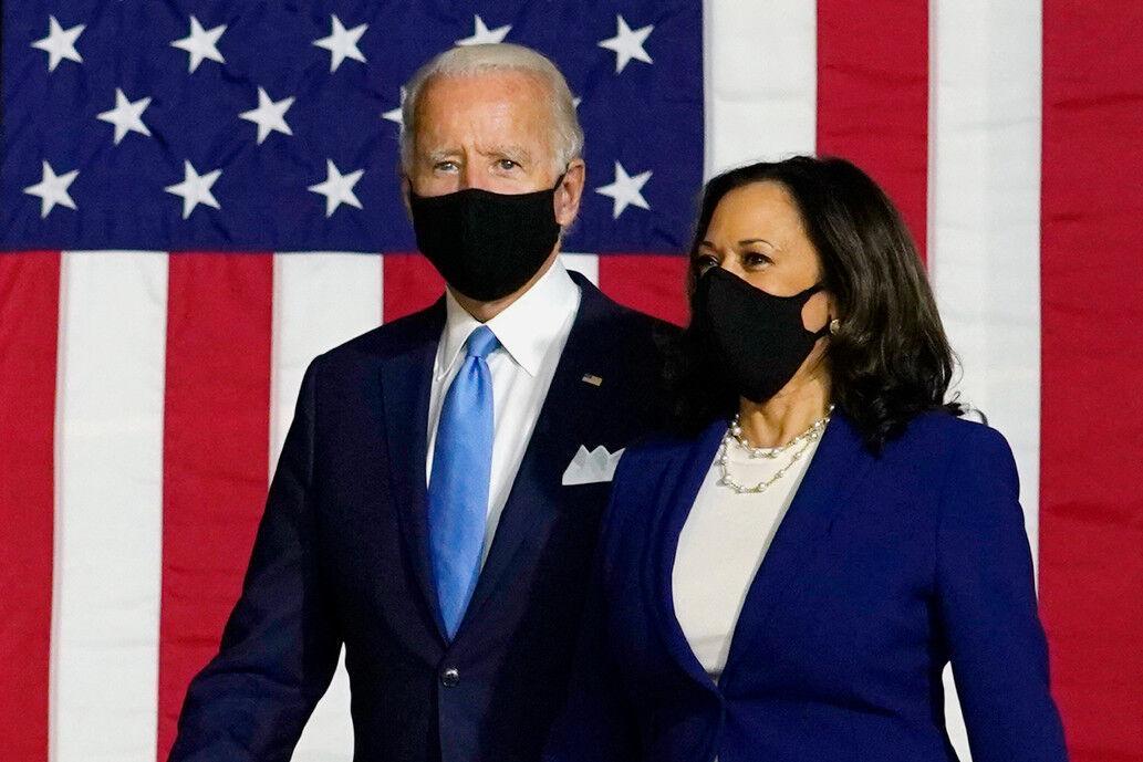 Democratic presidential candidate former Vice President Joe Biden and his running mate Sen. Kamala Harris, D-Calif., arrive to speak at a news conference at Alexis Dupont High School in Wilmington, Del.