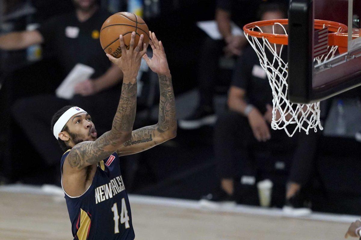 In this July 30, 2020, file photo, New Orleans Pelicans' Brandon Ingram heads to the basket during the first half of an NBA basketball game against the Utah Jazz in Lake Buena Vista, Fla. Ingram a restricted free agent, has agreed to a five-year, $158 million contract with the New Orleans Pelicans, said a person familiar with the situation. The person spoke to the Associated Press Tuesday, Nov. 24, 2020, on condition of anonymity because the contract has not been announced. (AP Photo/Ashley Landis, Pool, File)