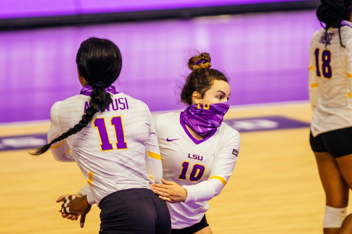 LSU volleyball sophomore middle blocker Anita Anwusi (11) substitutes in for sophomore defensive specialist Jill Bohnet (10) on Wednesday, Oct. 21, 2020 during LSU volleyball's 3-1 win against Mississippi State at the Pete Maravich Assembly Center on N Stadium Drive.