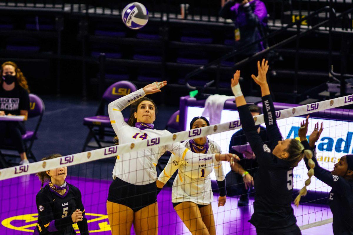 LSU volleyball sophomore middle blocker Allee Morris (14) jumps up for a spike on Wednesday, Oct. 21, 2020 during LSU volleyball's 3-1 win against Mississippi State at the Pete Maravich Assembly Center on N Stadium Drive.