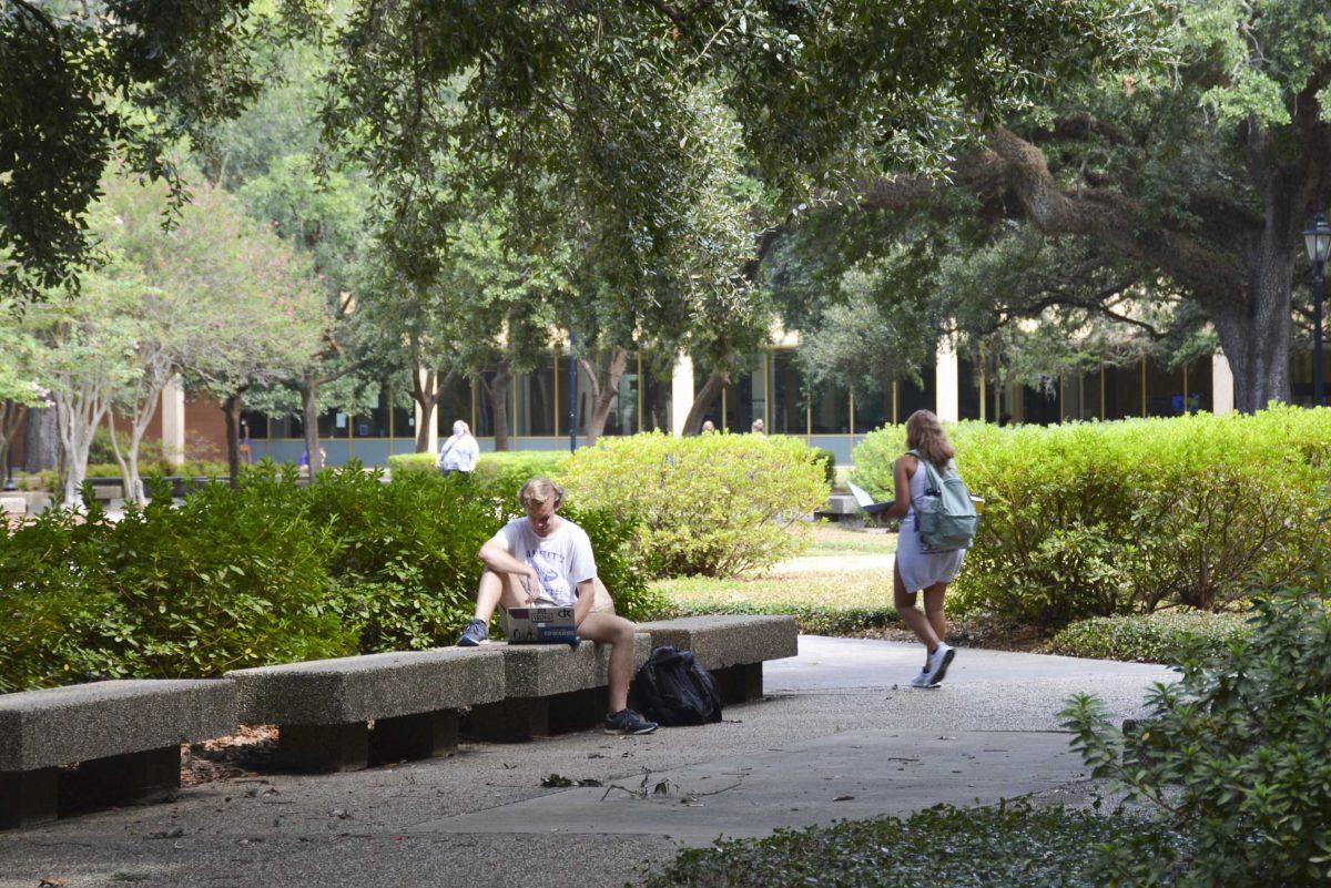 Senior, John Harris sits Tuesday, Aug. 25, 2020 on a bench in the Quad on LSU's campus.