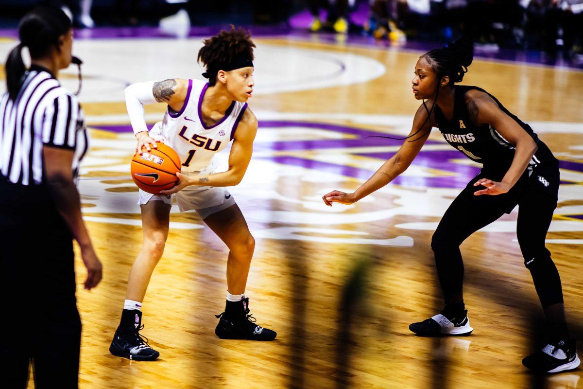 LSU women's basketball senior guard Jailin Cherry (1) gets ready to pass the ball while UCF senior guard and forward Courtajia Sanders (1) guards Friday, Dec. 4, 2020 during LSU's 48-58 loss against UCF in their home opener at the Pete Maravich Assembly Center in Baton Rouge, La.