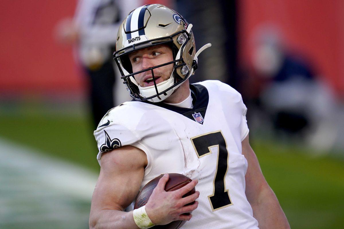 New Orleans Saints quarterback Taysom Hill (7) runs in for a touchdown during the first half of an NFL football game against the Denver Broncos, Sunday, Nov. 29, 2020, in Denver. (AP Photo/David Zalubowski)