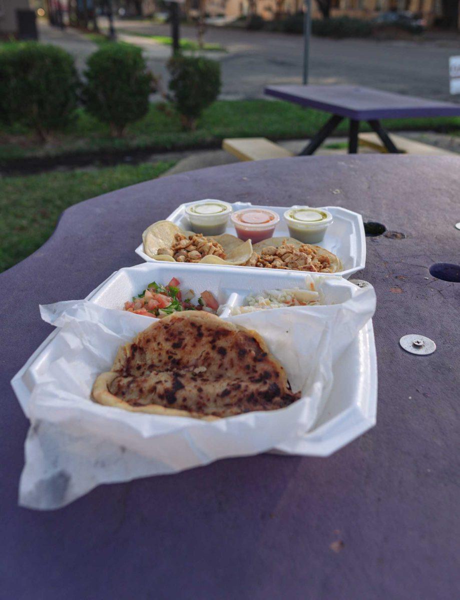 An order of pupusa de frijol con queso and two chicken tacos sits in its container on Jan. 27, 2021 at La Salvadore&#241;a Restaurant on Nicholson Dr.