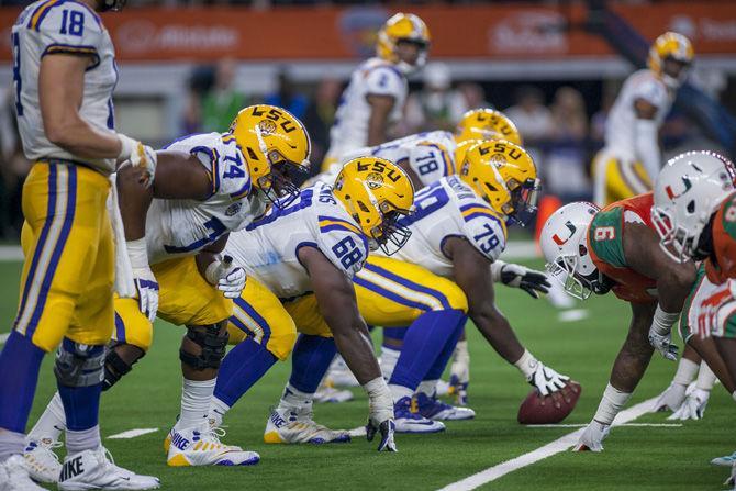 The LSU offensive line prepares for a play during the Tigers' 33-17 victory over Miami in the AdvoCare Classic on Sunday, Sept. 2, 2018 at AT&amp;T Stadium in Arlington, Texas.