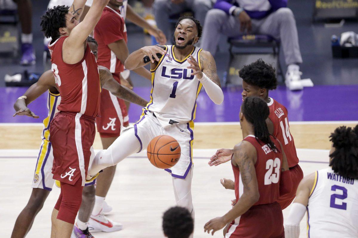 LSU guard Ja'Vonte Smart (1) loses the ball during the second half of the team's NCAA college basketball game against Alabama in Baton Rouge, La., Tuesday, Jan. 19, 2021. (AP Photo/Brett Duke)