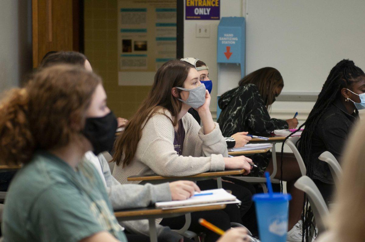 Students take notes Thursday, Jan. 21, 2021 while in French 1001 class in Lockett Hall.