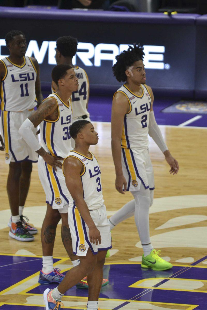 LSU men's basketball sophomore forward Trendon Watford (2), LSU men's basketball sophomore forward Shareef O'Neal (32), and LSU men's basketball freshman guard Jalen Cook (3) wait for game to continue Tuesday, Jan. 19, 2021 during LSU's 75-105 loss to Alabama at Pete Maravich Assembley Center on N Stadium Drive in Baton Rouge, La.