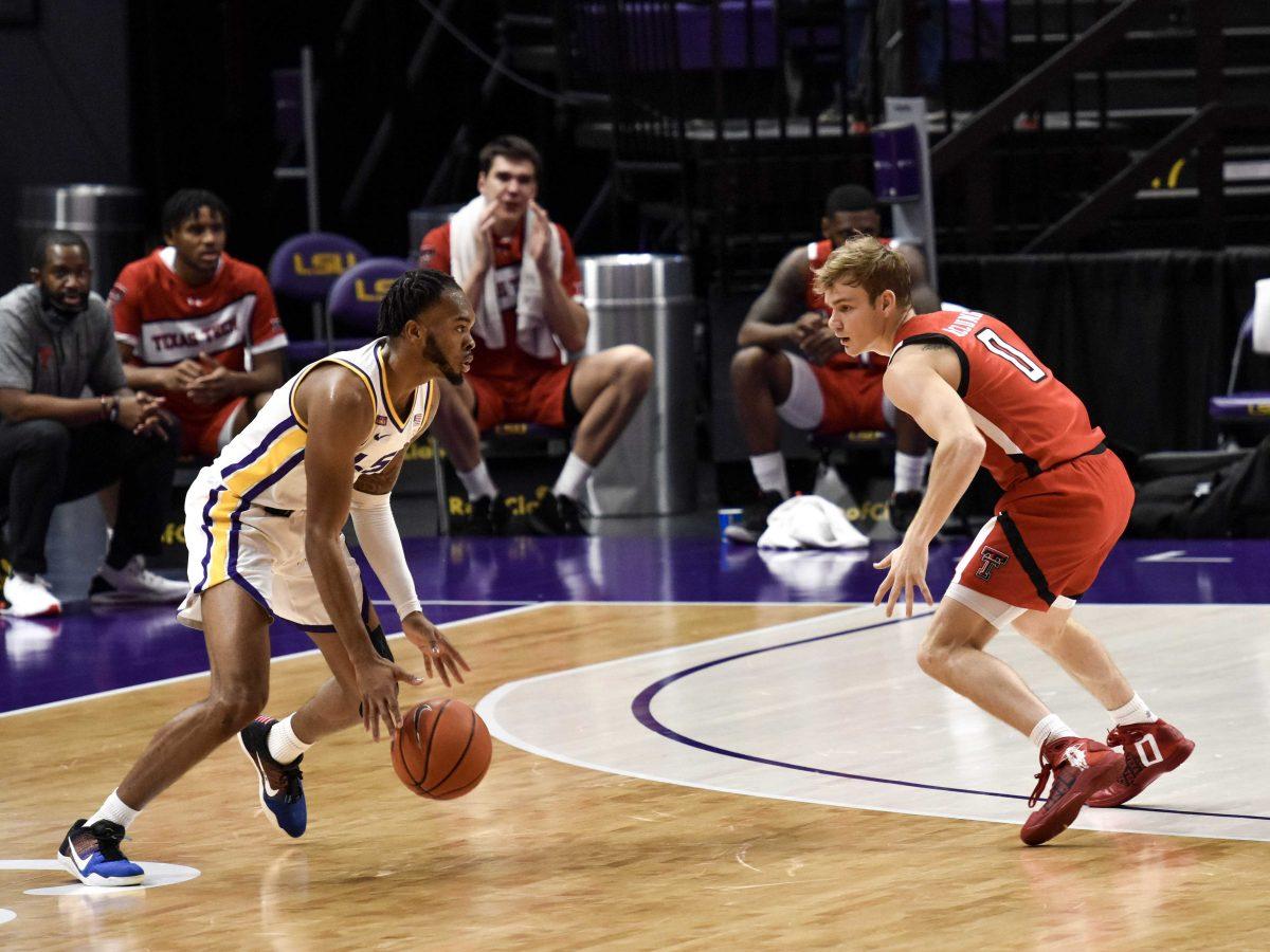 LSU men's basketball junior guard Javonte Smart dribbles in front of Texas Tech men's basketball junior guard (0) Mac McClung guards Saturday, Jan. 30, 2021 during LSU's 76-71 loss against Texas Tech at the Pete Maravich Assembly Center on N Stadium Drive in Baton Rouge, La.&#160;