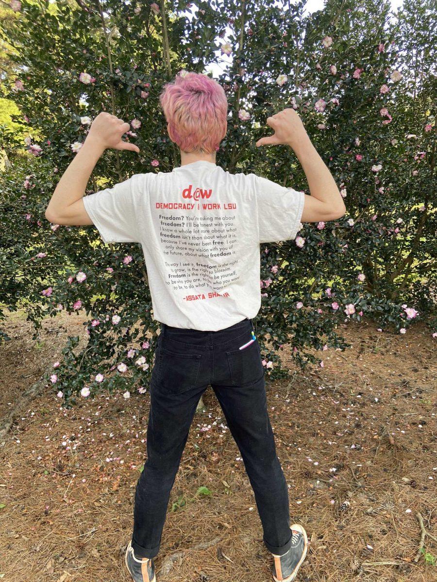 Democracy at Work member and sociology senior Sebastian Brumfield Mejia wears the t-shirt used to raise money for East Baton Rouge Parish Prison bond payments.&#160;