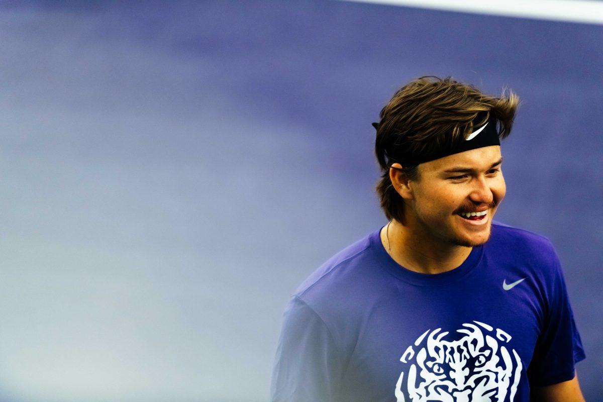 LSU men's tennis redshirt-sophomore Boris Kozlov smiles after winning the first set in doubles Sunday, Jan. 17, 2021 during LSU's 7-0 win against Alcorn State in the LSU Tennis Complex on Gourrier Avenue in Baton Rouge, La.