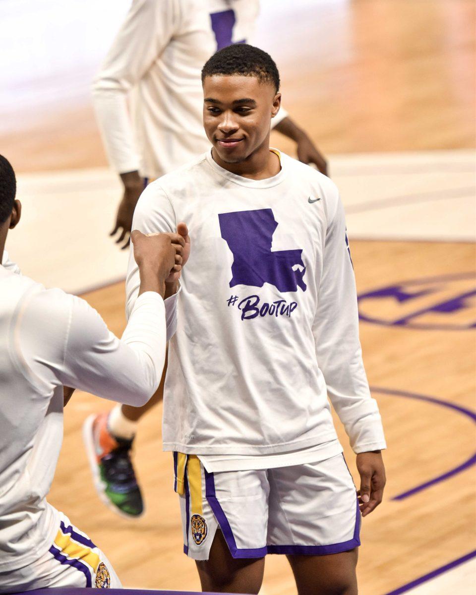 LSU men's basketball freshman guard Jalen Cook (3) fist bumps a teammate Saturday, Jan. 30, 2021 before LSU's 76-71 loss against Texas Tech at the Pete Maravich Assembly Center on N Stadium Drive in Baton Rouge, La.&#160;