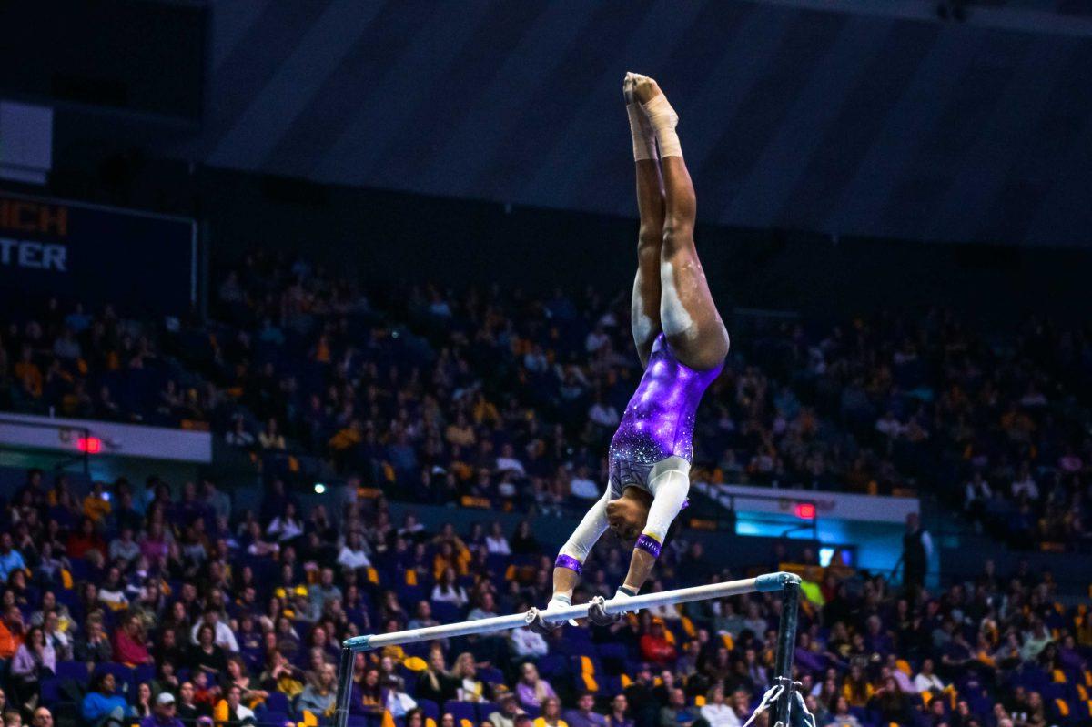 LSU gymnast freshman all-around Kiya Johnson performs her bars routine on Friday, Feb. 28, 2020 during LSU's 197.125-195.725 victory over Arkansas in the PMAC.