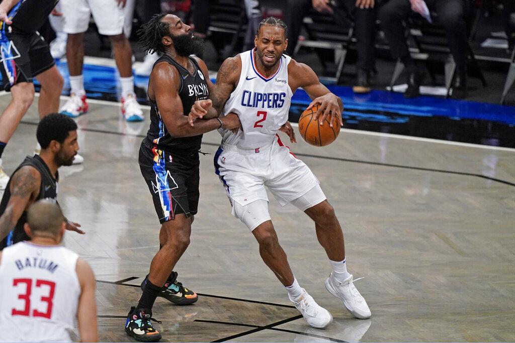 Brooklyn Nets guard James Harden defends against Los Angeles Clippers forward Kawhi Leonard (2) during the second half of an NBA basketball game Tuesday, Feb. 2, 2021, in New York.