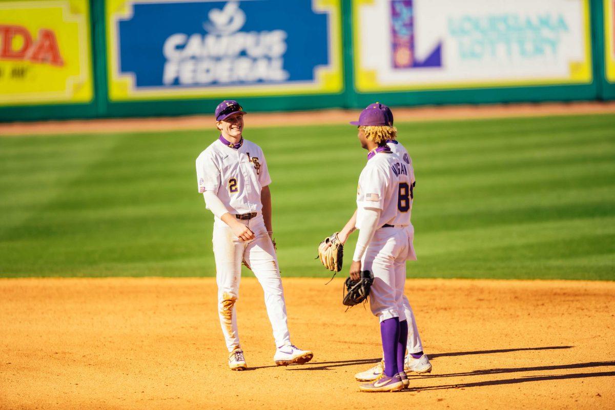 LSU baseball sophomore infielder Zach Arnold (2) laughs with freshman first baseman Tre' Morgan (18) Saturday, Feb. 20, 2021 during LSU's 6-1 win over Air Force at Alex Box Stadium on Gourrier Avenue in Baton Rouge, La.