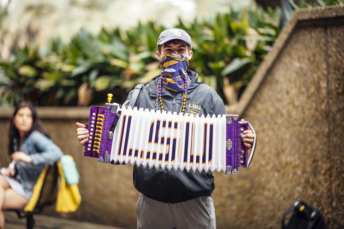 LSU agriculture senior Colt Hardee plays his LSU accordion Wednesday, Feb. 10, 2021 during the LSU Student Activities Board Mardi Gras Mambo event in front of the Student Union on LSU's campus in Baton Rouge, La.