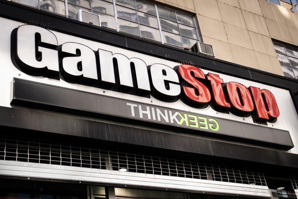 FILE -&#160;Pedestrians pass a GameStop store on 14th Street at Union Square, Thursday, Jan. 28, 2021, in the Manhattan borough of New York. Robinhood and other online trading platforms are moving to restrict trading in GameStop and other stocks that have soared recently due to rabid buying by smaller investors. GameStop stock has rocketed from below $20 to more than $400 this month as a volunteer army of investors on social media challenged big institutions who has placed market bets that the stock would fall. (AP Photo/John Minchillo)