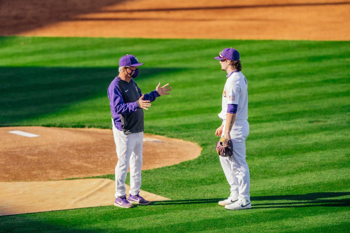 LSU baseball head coach Paul Mainieri coaches freshman infielder and outfielder Dylan Crews (3) Friday, Jan. 29, 2021 during baseball white vs. gold media day at Alex Box Stadium on Gourrier Avenue in Baton Rouge, La.