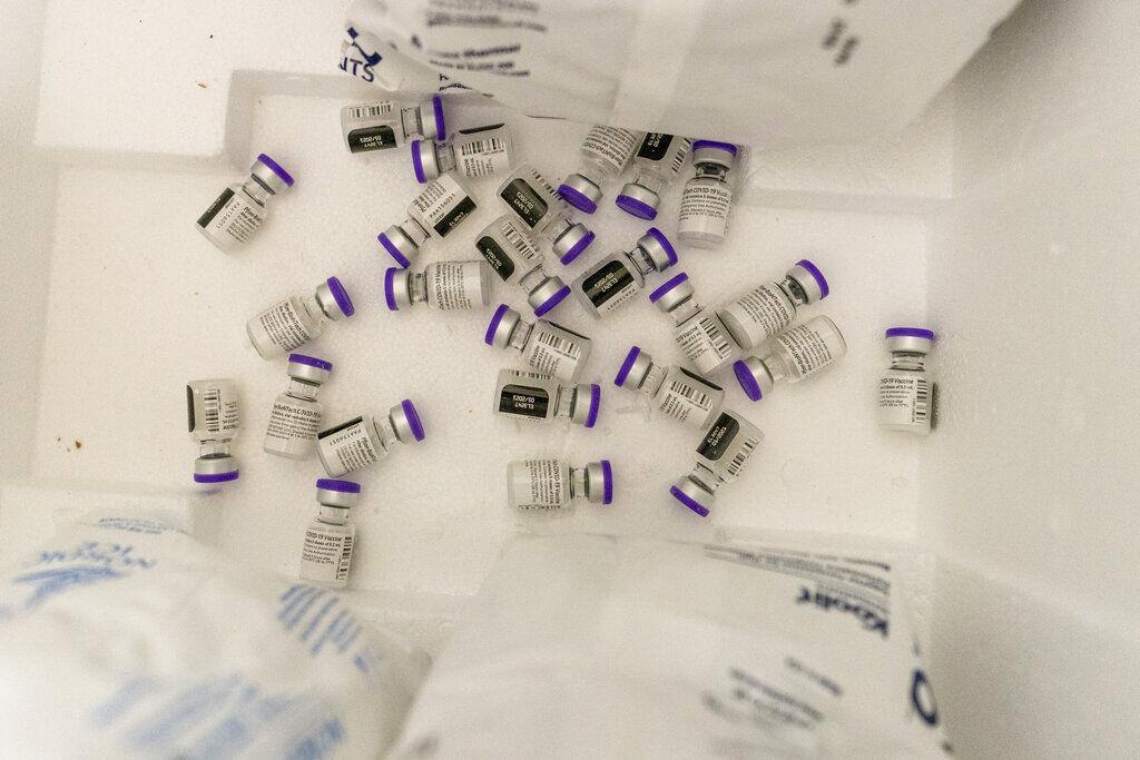 Vials with the Pfizer-BioNTech COVID-19 Vaccine are seen in a cooler before being thawed at a pop-up COVID-19 vaccination site at St. Luke's Episcopal Church, Tuesday, Jan. 26, 2021, in the Bronx borough of New York. (AP Photo/Mary Altaffer)