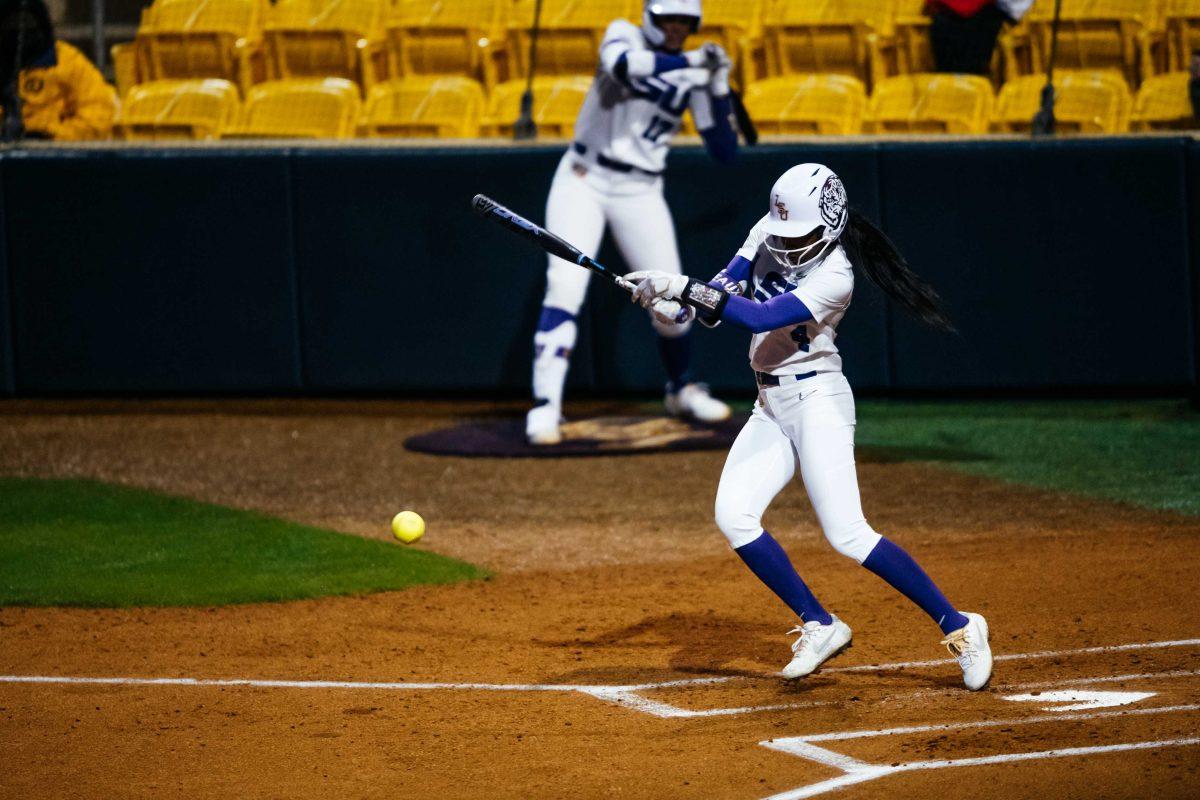 LSU softball senior outfielder Aliyah Andrews (4) hits the ball Thursday, Feb. 12, 2021 during LSU's 8-0 win over McNeese at Tiger Park on Skip Bertman Drive in Baton Rouge, La.