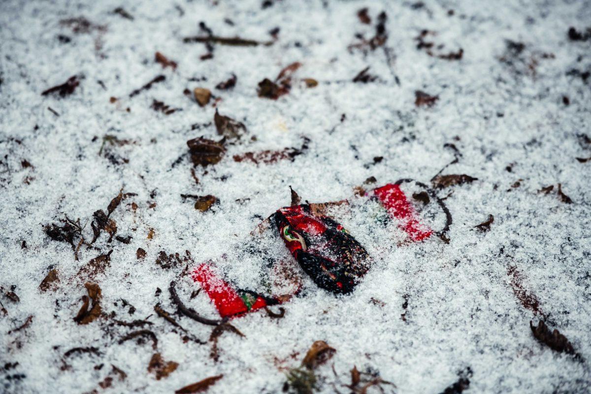 Ice covers a mask on the ground Monday, Feb. 15, 2021 during the winter weather mix on N. Stadium Drive on LSU's campus in Baton Rouge, La.