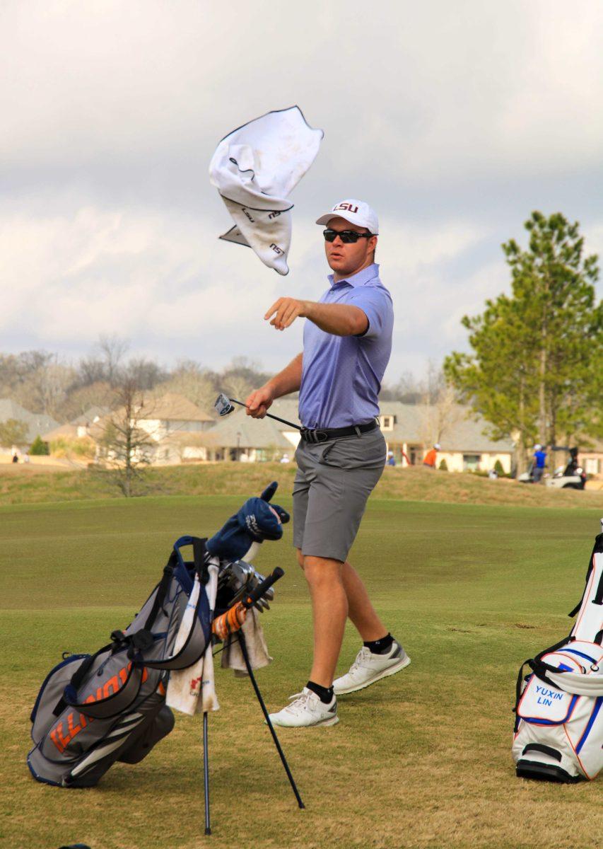 LSU men's golf junior Trey Winstead throws his towel back to his caddy on Friday, Feb. 26, 2021 during the LSU Invitational at the University Club on Memorial Tower Drive in Baton Rouge, La.