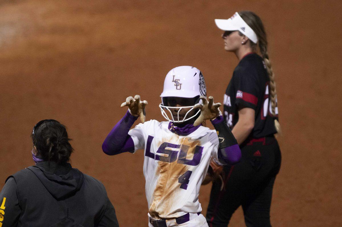 LSU softball senior outfielder Aliyah Andrews (4) celebrates a hit Saturday, Feb. 27, 2021 during LSU's 3-2 win over UL-Lafayette at Tiger Park on Skip Bertman Drive in Baton Rouge.