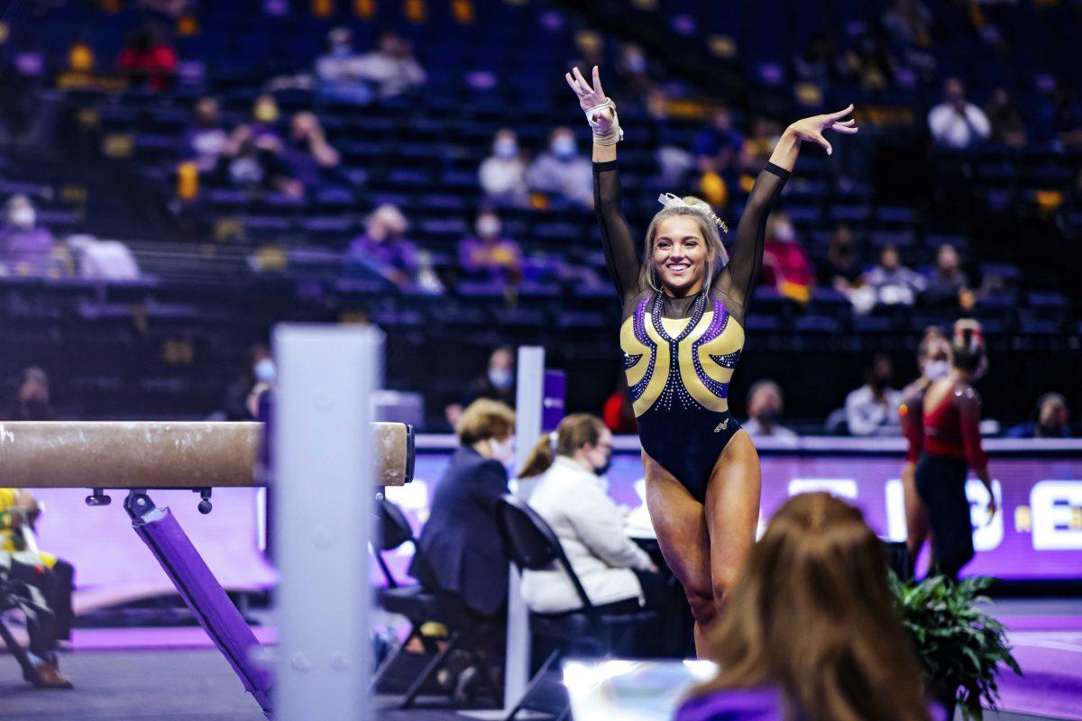 LSU gymnastics senior balance beam and floor Reagan Campbell smiles Friday, Jan. 8, 2021 after her beam routine during No. 3 LSU gymnastics' 196.550-196.350 win against No. 15 Arkansas in the Pete Maravich Assembly Center on N Stadium Drive in Baton Rouge, La.