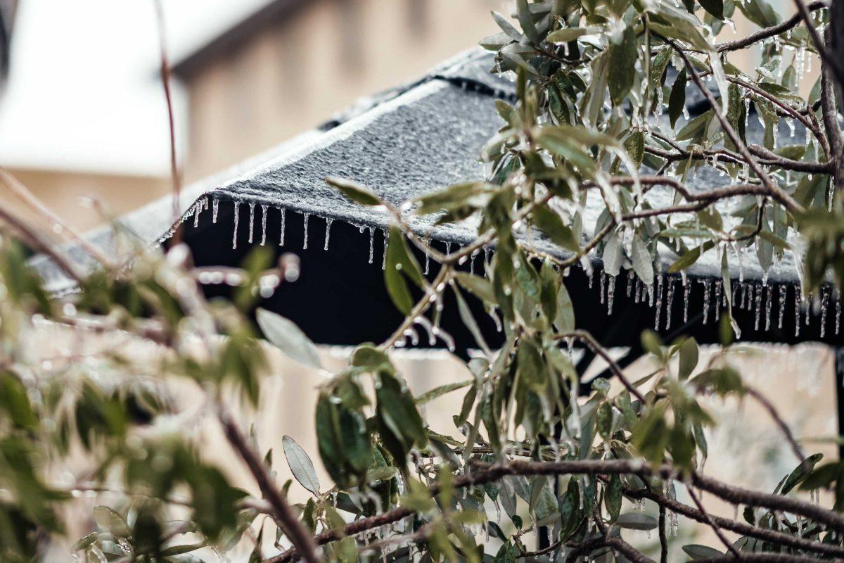 Icicles hang off of the Starbucks umbrella Monday, Feb. 15, 2021 during the winter weather mix at the LSU Nicholson Gateway apartments on Nicholson Drive in Baton Rouge, La.